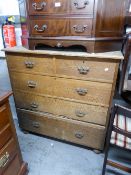A LATE VICTORIAN OAK CHEST OF DRAWERS