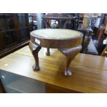 a MAHOGANY CIRCULAR LOW JARDINIERE STAND, on four cabriole legs