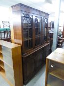 A REPRODUCTION BOOKCASE, GLAZED UPPER PORTION WITH DRAWERS AND CUPBOARDS UNDER