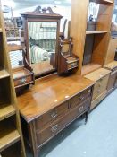 AN EDWARDIAN WALNUTWOOD DRESSING CHEST WITH SWING MIRROR, TWO SHORT AND ONE LONG DRAWER
