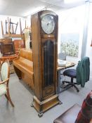 A 1930's ENFIELD LONGCASE CLOCK, WITH 8 DAYS WEIGHT DRIVEN MOVEMENT, CIRCULAR SILVERED DIAL, THE