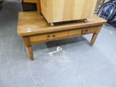 A LOW OBLONG LARGE COFFEE TABLE, ON TURNED TAPERING LEGS, FITTED WITH TWO SIDE DRAWERS