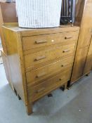 AN OAK CHEST OF FOUR GRADUATED LONG DRAWERS