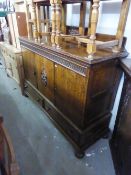 A 1930's OAK SIDEBOARD WITH THREE DOORS ABOVE THREE DRAWERS, WITH FITTED INTERIOR DRAWERS AND LOW