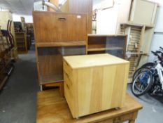A TEAK STEP TOP BOOKCASE WITH GLASS SLIDING DOORS AND A PINE THREE DRAWER FILING CABINET (2)