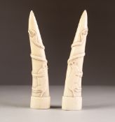 PAIR OF AFRICAN CARVED IVORY TUSKS, each carved in low relief with a four legged mammal and a snake,