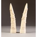 PAIR OF AFRICAN CARVED IVORY TUSKS, each carved in low relief with a four legged mammal and a snake,