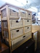 A LIGHT WOOD UNIT WITH EIGHT VARIOUS SIZE FITTED WICKER DRAWERS AND A SIMILAR SMALLER UNIT WITH FOUR