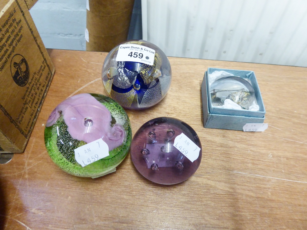 A CAITHNESS 'CALYPSO' PAPERWEIGHT, ANOTHER BY MIKE HUNTER AND TWO SMALLER EXAMPLES (4)