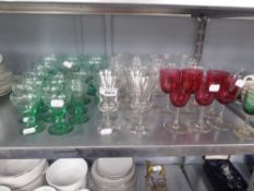 A SET OF SIX EARLY TWENTIETH CENTURY PORT GLASSES WITH CRANBERRY GLASS BOWLS; PART TABLE SERVICE