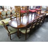 A GOOD QUALITY MAHOGANY REPRODUCTION DINING TABLE WITH TWO EXTRA LEAVES AND A SET OF TEN DINING