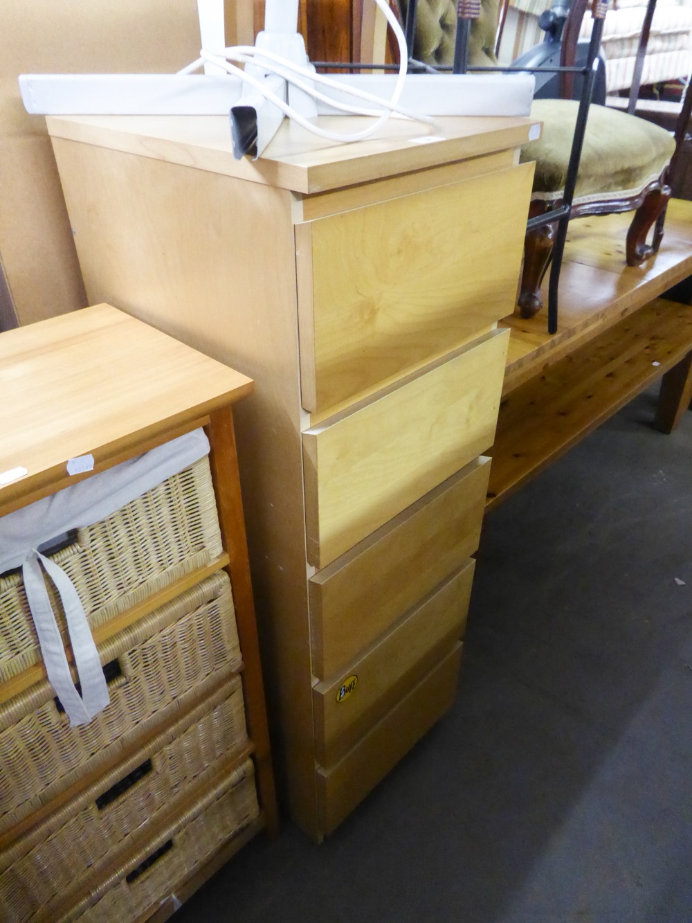 A TALL NARROW LIGHTWOOD CHEST OF FIVE DRAWERS