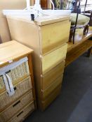 A TALL NARROW LIGHTWOOD CHEST OF FIVE DRAWERS