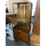 AN OAK TWO TIER OBLONG OCCASIONAL TABLE WITH CANTED FLUTED PANEL LEGS