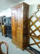 A LATE NINETEENTH/EARLY CENTURY MAHOGANY COMBINATION WARDROBE WITH AN ARRANGEMENT OF ONE LONG DOOR