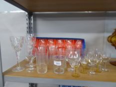 A QUANTITY OF CUT GLASS DRINKING GLASSES, SOME WITH ETCHED DETAIL