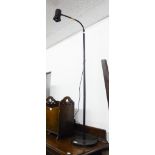 AN IKEA BLACK METAL FLOOR LAMP WITH ADJUSTABLE TOP
