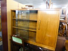 A WALNUTWOOD SMALL BOOKCASE WITH GLASS SLIDING DOORS AND END CUPBOARD