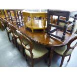 A GOOD QUALITY MAHOGANY REPRODUCTION DINING TABLE WITH TWO EXTRA LEAVES AND A SET OF TEN DINING