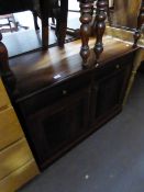 A DARK WOOD SMALL CABINET WITH TWO DRAWERS OVER TWO CUPBOARD DOORS