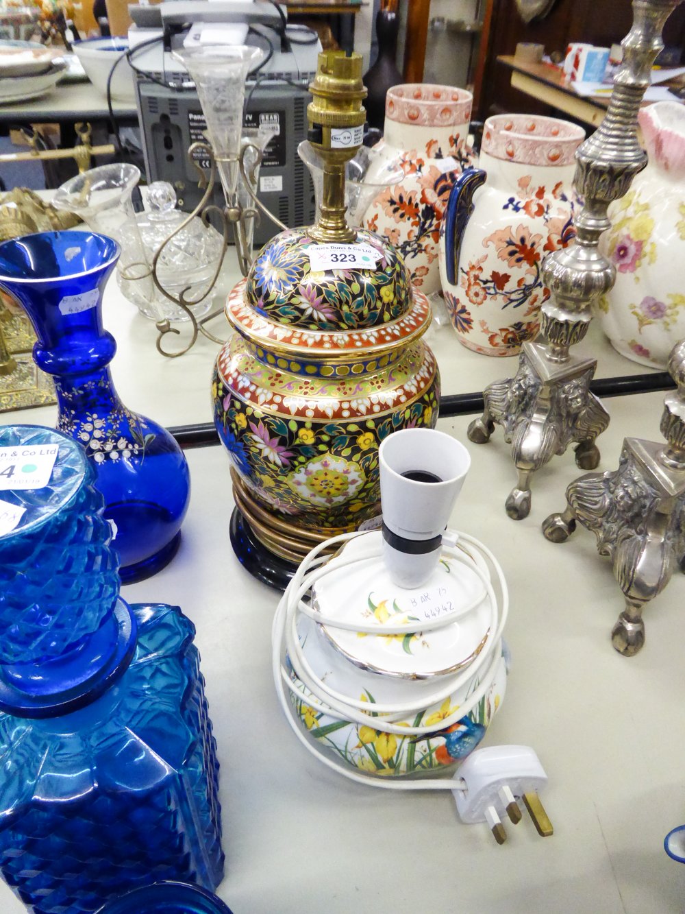 A MODERN TABLE LAMP WITH ELABORATE GILT AND COLOURED DECORATION THROUGHOUT AND A SQUAT EXAMPLE