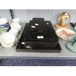 A SET OF SIX BLACK STONE OBLONG TABLE MATS AND EIGHT MATCHING DRINKS MATS ETC.....