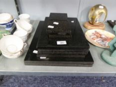 A SET OF SIX BLACK STONE OBLONG TABLE MATS AND EIGHT MATCHING DRINKS MATS ETC.....