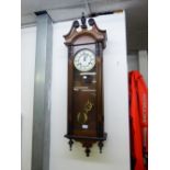 A WALNUTWOOD CASED VIENNA WALL CLOCK WITH SPRING DRIVEN MOVEMENT