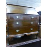 OAK BUREAU WITH THREE LONG DRAWERS, ON CABRIOLE SUPPORTS