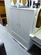 A SMALL WHITE FINISH BEDROOM SUITE COMPRISING; A LOW HANG WARDROBE WITH TWO LONG DRAWERS BELOW; A