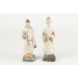 A PAIR OF AGED CHINESE WHITE CHALK SURFACED TERRACOTTA BISCUIT ATTENDANT FIGURES with remnants of