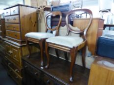 A PAIR OF VICTORIAN MAHOGANY BALLOON BACK SINGLE CHAIRS, ON CABRIOLE FRONT SUPPORTS