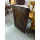 VICTORIAN OAK CORNER CUPBOARD HAVING SOLID PANEL DOOR ENCLOSED THREE SHAPED SHELVES