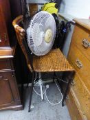 AN ELECTRIC FLOOR STANDING FAN AND A BREAKFAST BAR STOOL WITH WICKER SEAT (2)