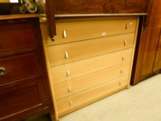 A MODERN BEECHWOOD CHEST OF FIVE LONG DRAWERS