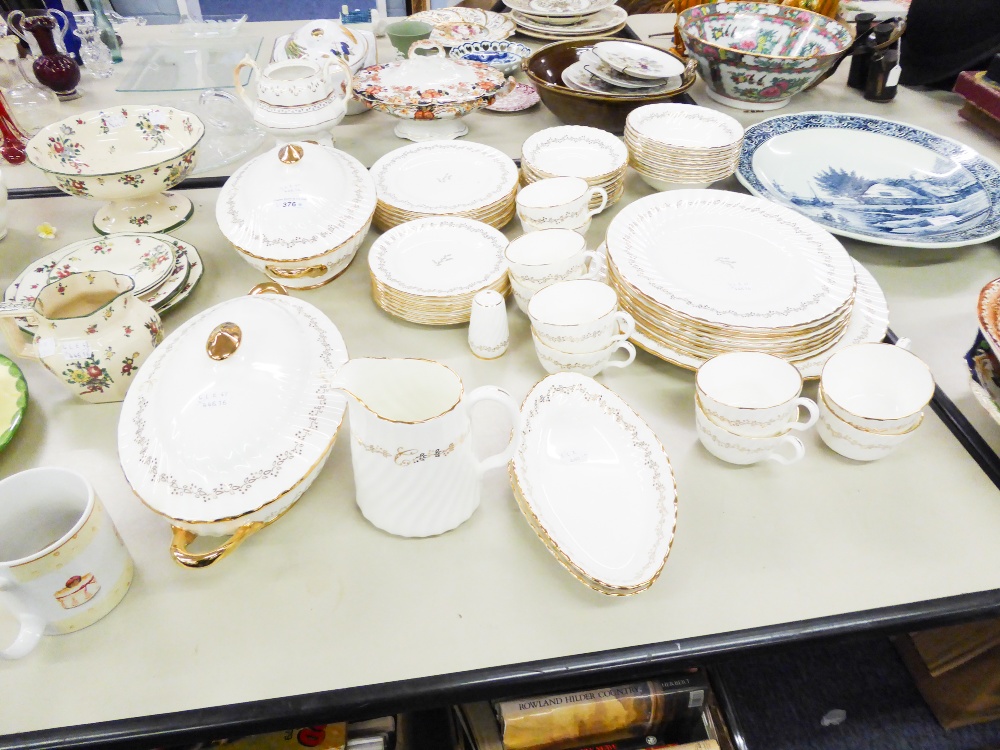 WHITE CHINA EXTENSIVE DINNER AND TEA SERVICE, SUFFICIENT FOR 8 PERSONS, 50 PIECES, HAND DECORATED