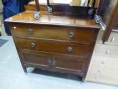 AN EDWARDIAN INLAID MAHOGANY CHEST OF TWO LONG DRAWERS OVER A CUPBOARD BASE