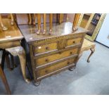 AN OAK CHEST OF THREE LONG DRAWERS