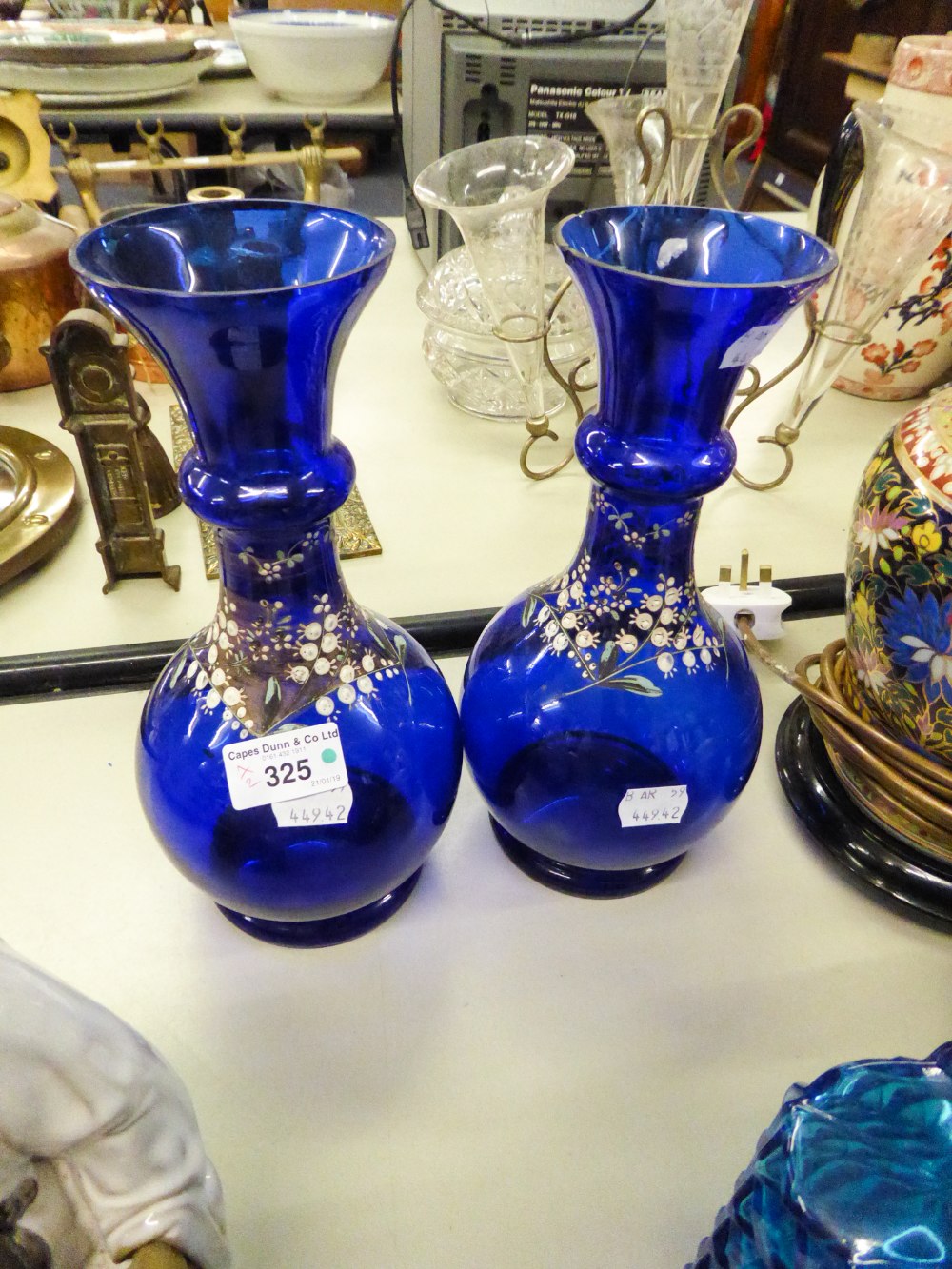 A PAIR OF BOHEMIAN BLUE GLASS VASES OF BALUSTER FORM AND PAINTED FLORAL DECORATION (2)