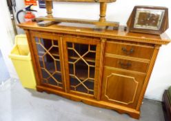 A MAHOGANY SMALL BOOKCASE WITH TWO ASTRAGAL GLAZED DOORS WITH END CUPBOARD AND TWO SHORT DRAWERS