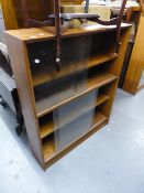 A SET OF THREE TEAK BOOKCASES, ALL WITH GLASS SLIDING DOORS, ENCLOSING THREE SHELVES (3)