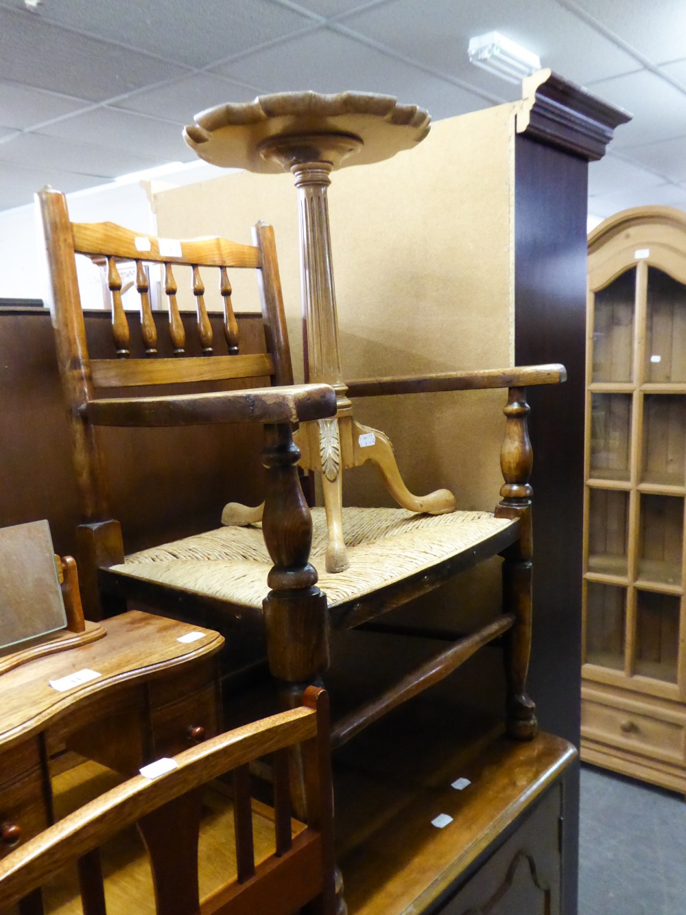 AN ELM LOW SEATED RUSH SEAT ARMCHAIR AND A TRIPOD WINE TABLE