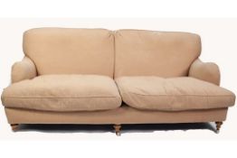 MODERN, FULLY UPHOLSTERED FOUR SEATER SETTEE with two loose cushions, on turned forelegs with