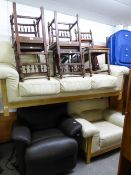 A CREAM HIDE HIDE LOUNGE SUITE, VIZ A THREE SEATER SETTEE AND A LOUNGE SUITE ON A PALE BEECH WOOD