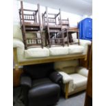 A CREAM HIDE HIDE LOUNGE SUITE, VIZ A THREE SEATER SETTEE AND A LOUNGE SUITE ON A PALE BEECH WOOD