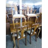 A REPRODUCTION WALNUTWOOD DINING ROOM SUITE OF 10 PIECES VIZ DRAW LEAF TABLE, SIDEBOARD AND 8 CHAIRS