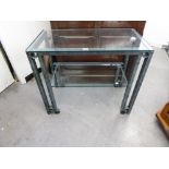 A MODERN METAL FRAMED SIDE TABLE WITH BEVEL GLASS TOP OVER UNDERTIER, WITH PATINATION TO THE FRAME