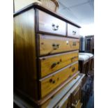 A PINE CHEST OF TWO SHORT AND TWO LONG DRAWERS AND A PINE WARDROBE WITH TWO PLANKED DOORS (2)