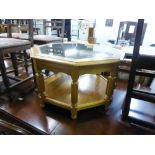 A LIGHTWOOD OCTAGONAL COFFEE TABLE WITH GLASS TOP AND A SOLID UNDERSHELF