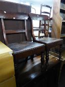 A PAIR OF ANTIQUE DINING CHAIRS, WITH PANEL SEATS